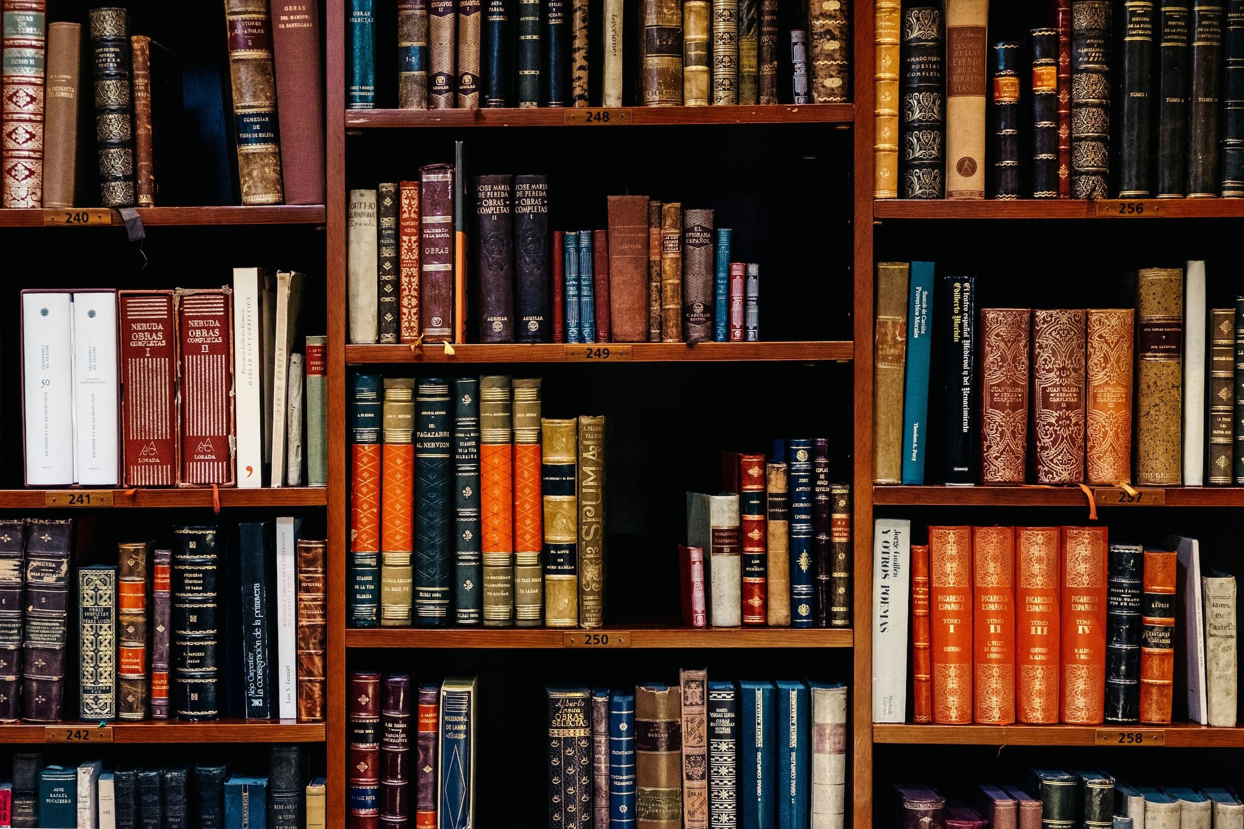 Shelves of antique books in a library